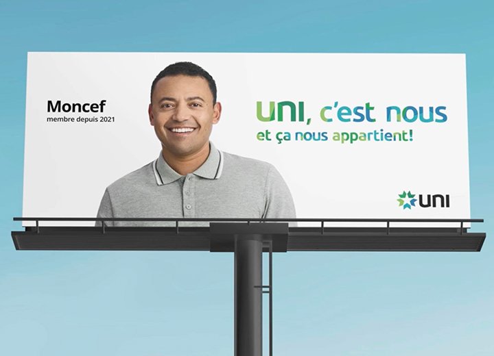 Outdoor billboard campaign featuring a smiling man with UNI branding and French-language messaging